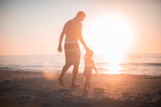 Father leading child